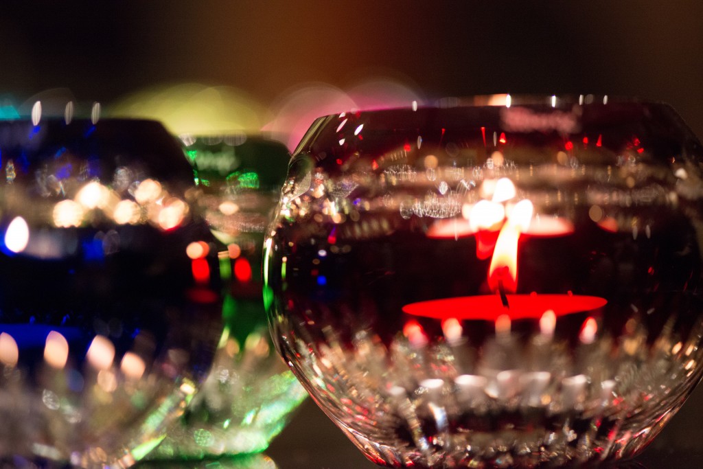 macro of candles in colored glass