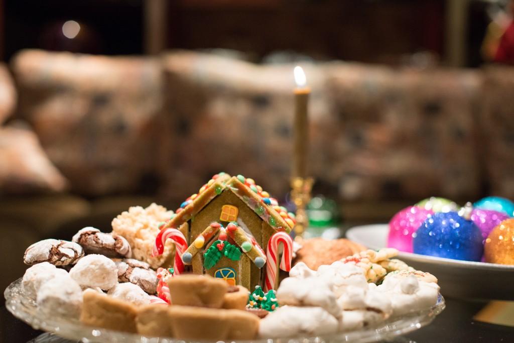 platter of Christmas cookies with a gingerbread house