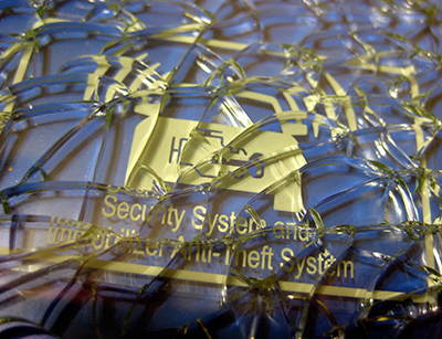 Broken glass with sticker reading [Security System and Immobilizer Anti-Theft System]