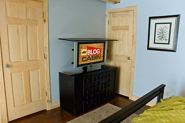 TV stand placed in front of door, which opens towards the stand