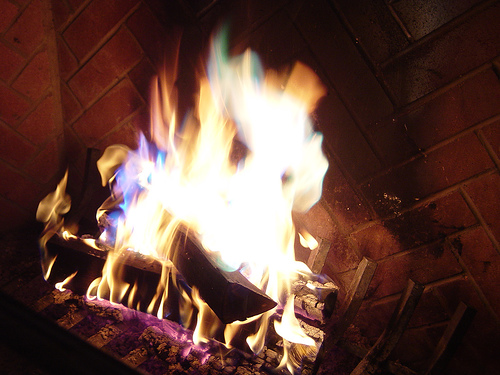 fire with green flames burning in a fireplace