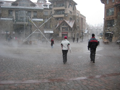 Courtyard with steam rising from the surface. It's snowing.