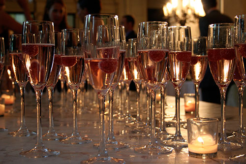 Champagne glasses with raspberries