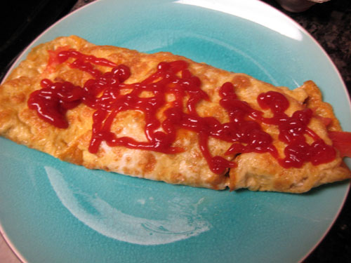 Omelette with ketchup on top