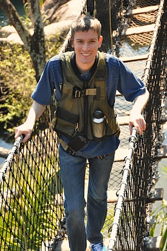 Michael Wyszomierski crossing a rope bridge