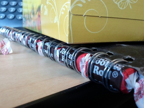Tootsie Rolls in the binding of a notebook