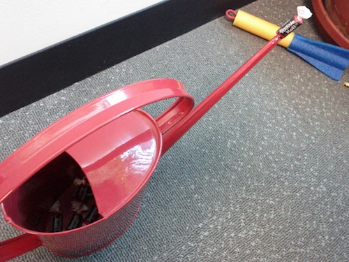 Tootsie Rolls in a red watering can