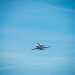 Space Shuttle Endeavour on top of NASA's Shuttle Carrier Aircraft, in the air, from the ground.